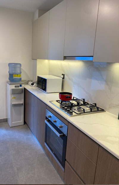 Modern hostel kitchen at Urban Panda Hostels DWTC